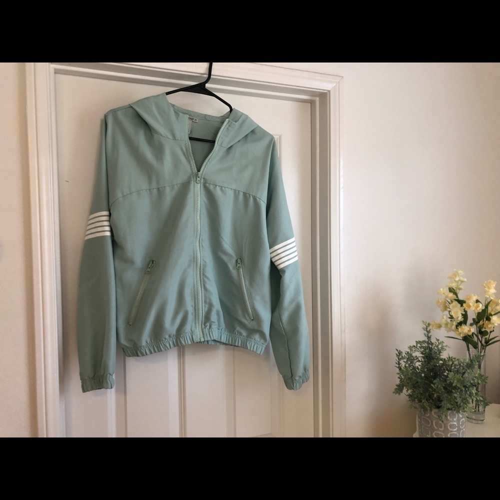 Greenish-blue wind breaker